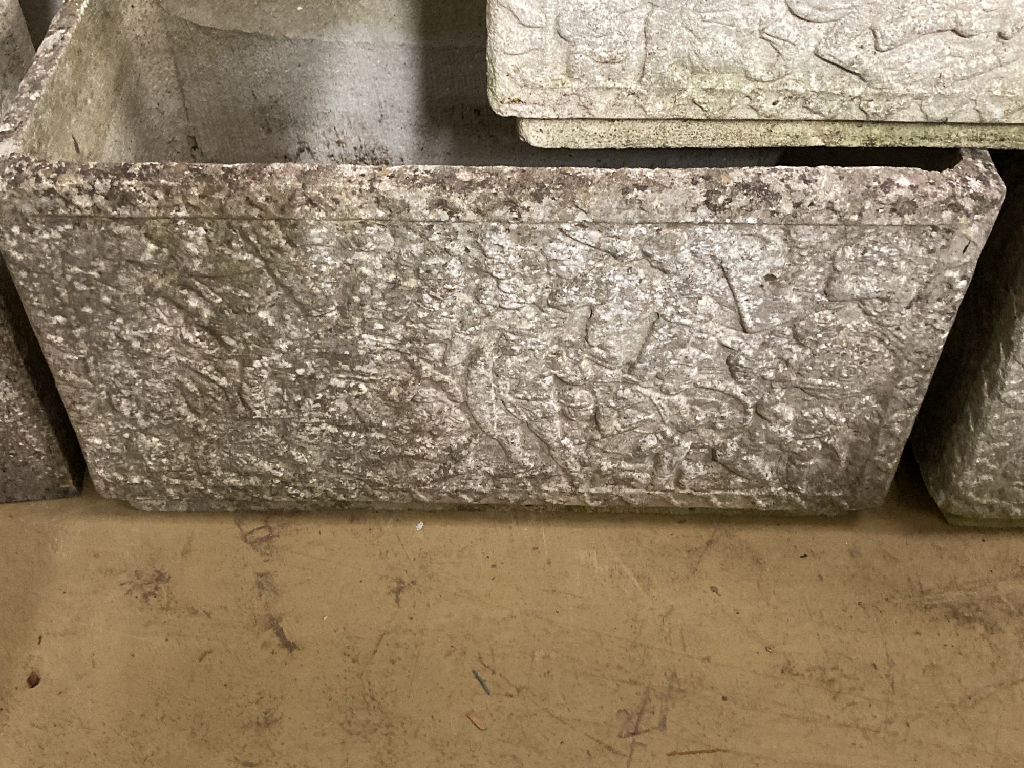 A set of three reconstituted stone rectangular garden planters with claw feet, width 77cm, depth 39cm, height 44cm